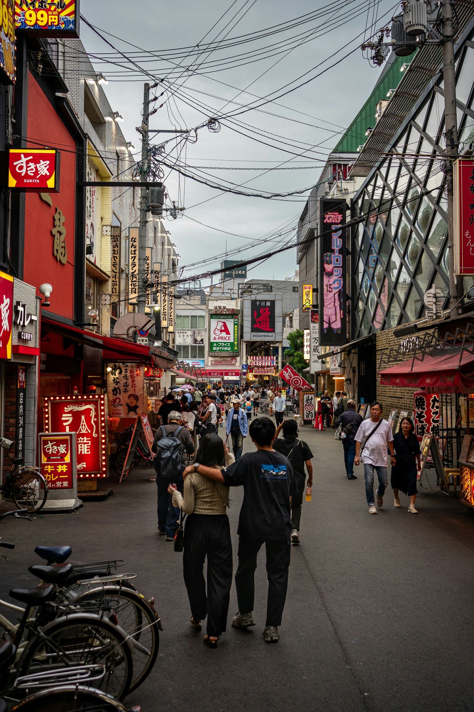 People walking along Sennichimae toward the Doguyasuji shopping arcade entrance