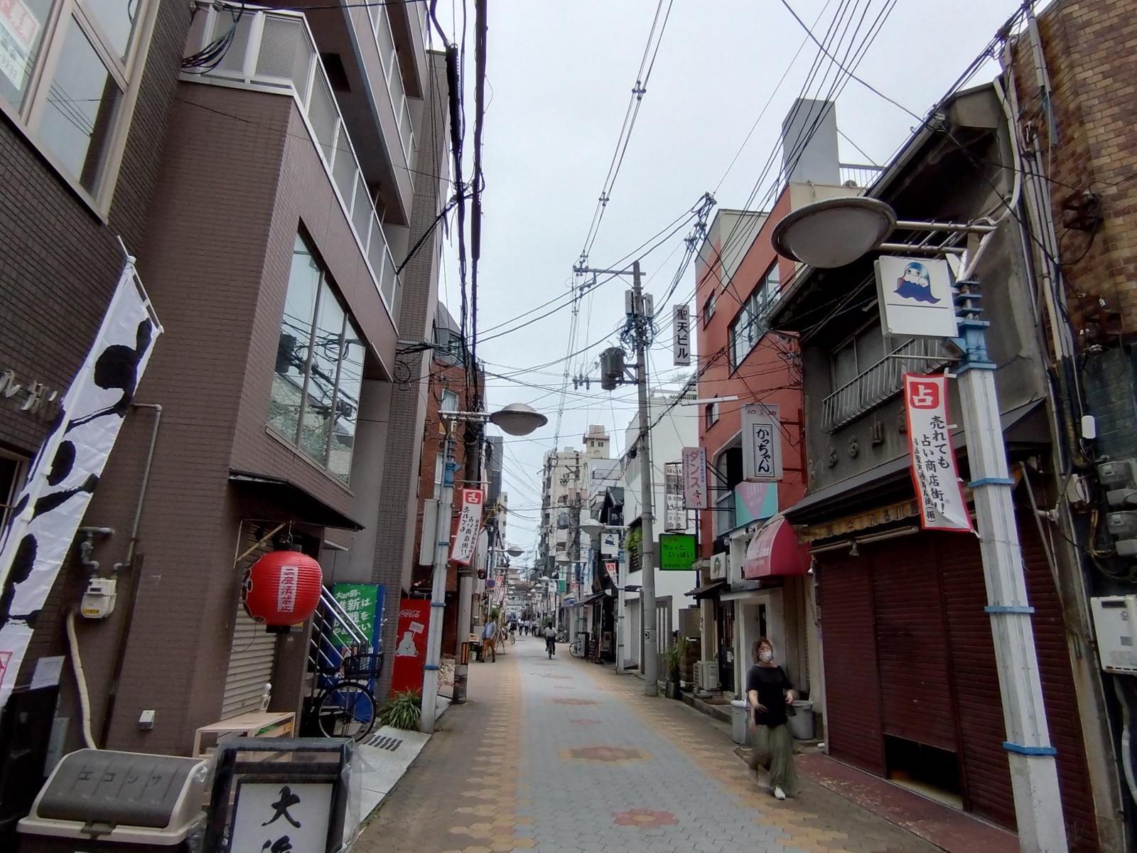 Small restaurants and hanging lanterns along a local street in Fukushima
