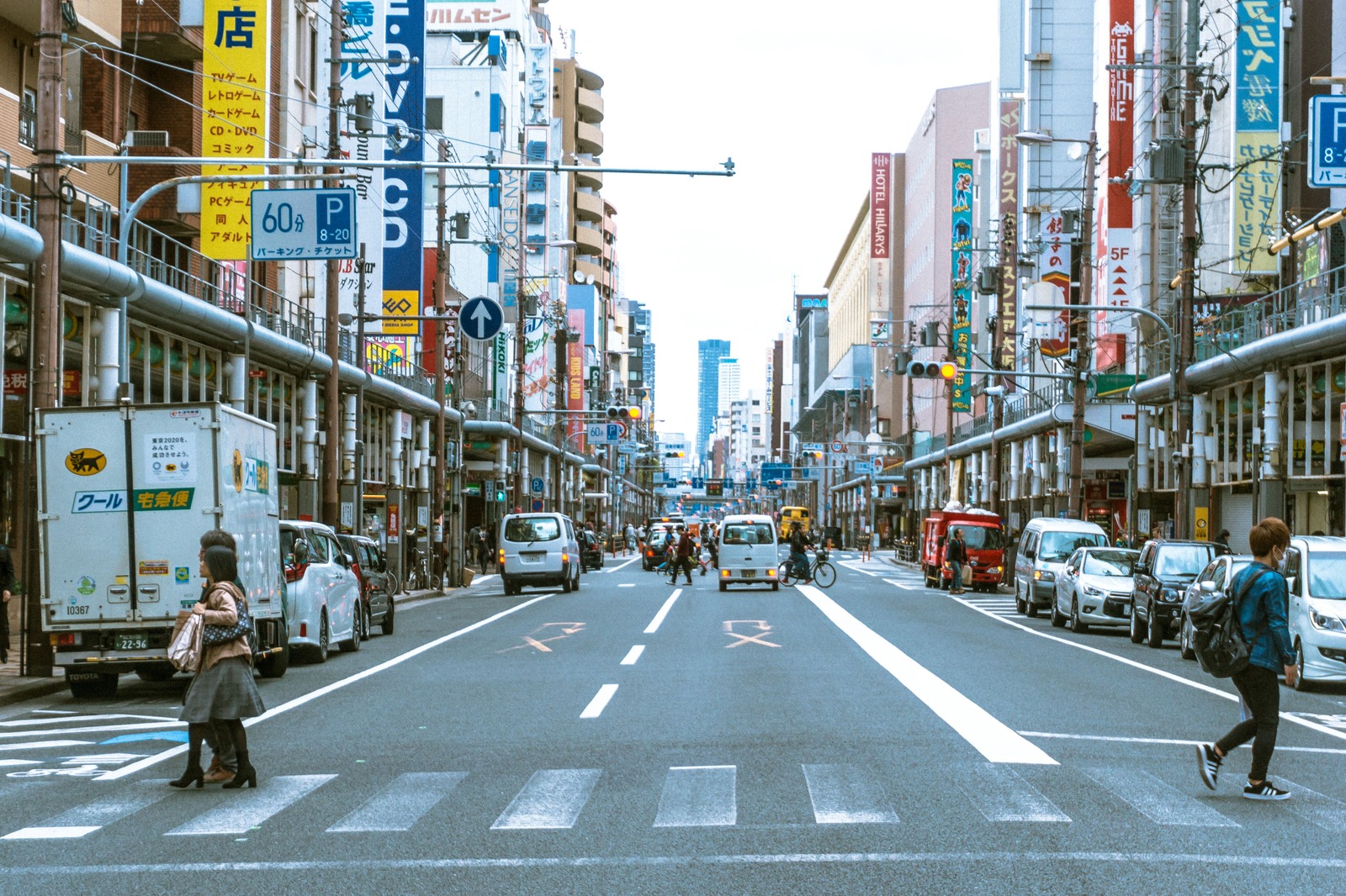 Electronics shops and colorful signs along the main street of Den Den Town in Nipponbashi