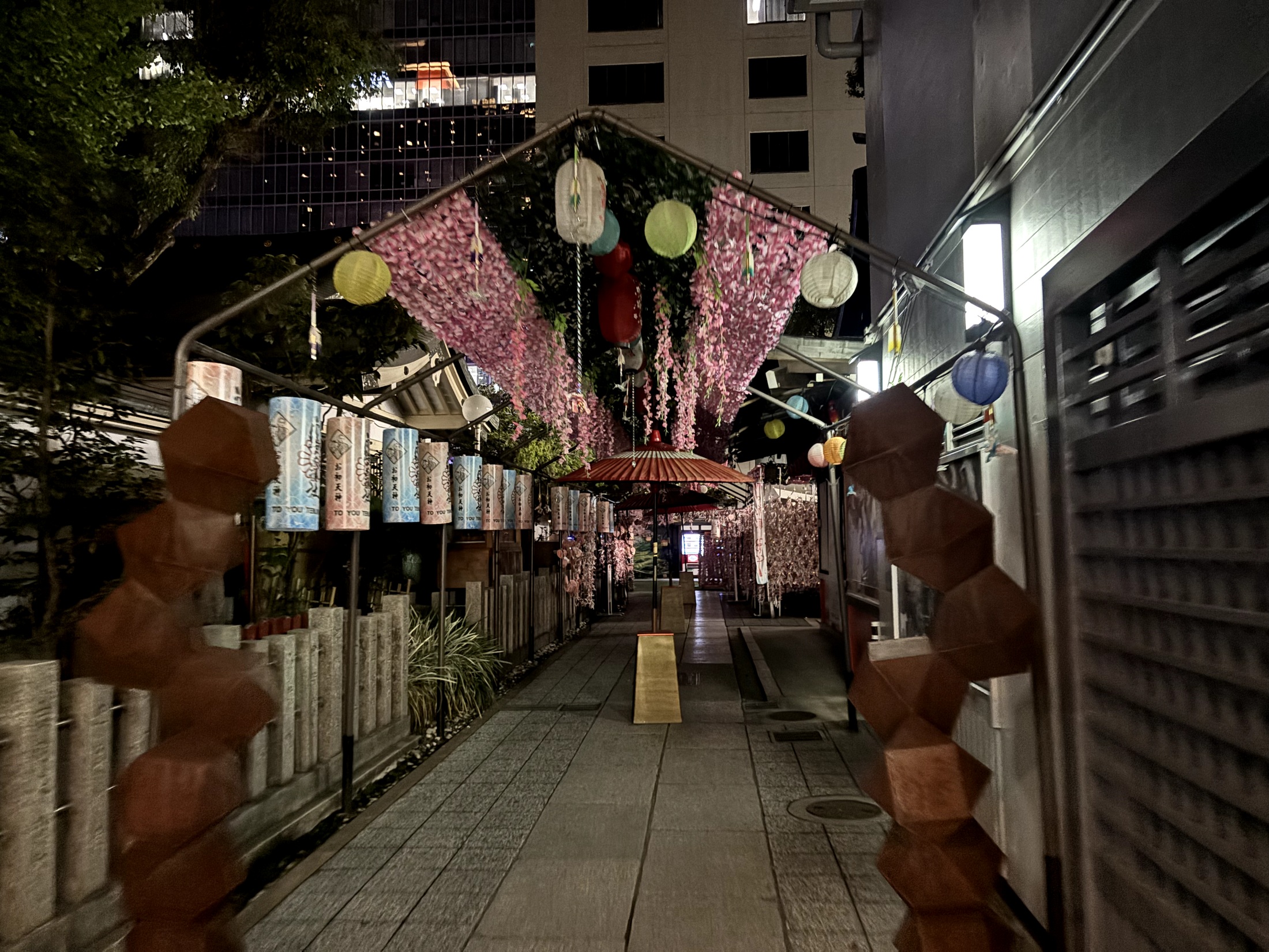 Colorful lanterns above a quiet path at Ohatsu Tenjin Shrine
