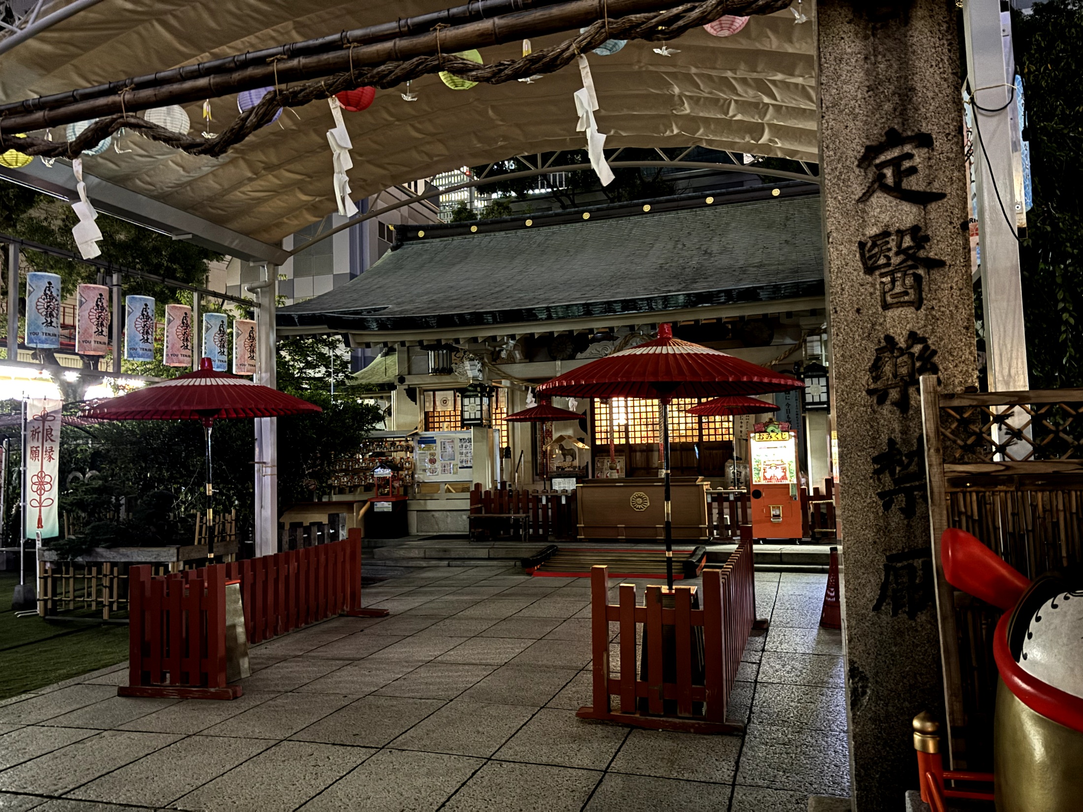 Lanterns and the worship hall of Ohatsu Tenjin Shrine seen through its entrance