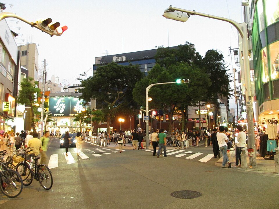 People and shops around Triangle Park in Amerikamura