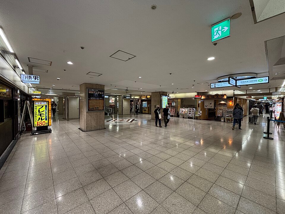 Shops and signs inside the basement of Osaka Ekimae Building No.2