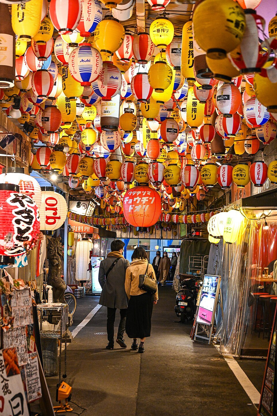 Rows of colourful paper lanterns above Ura-Tenma Lantern Street