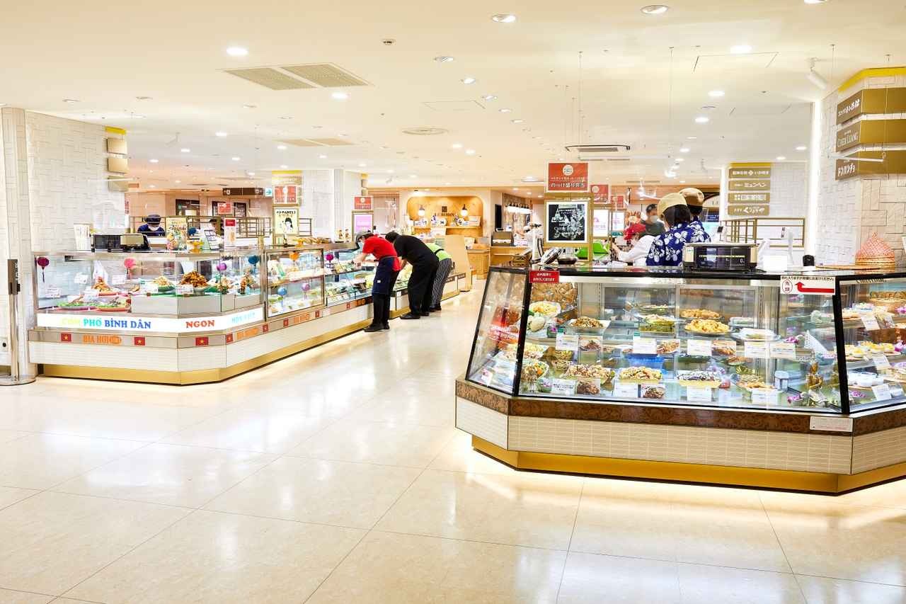 Prepared-food and confectionery counters inside a department-store food hall