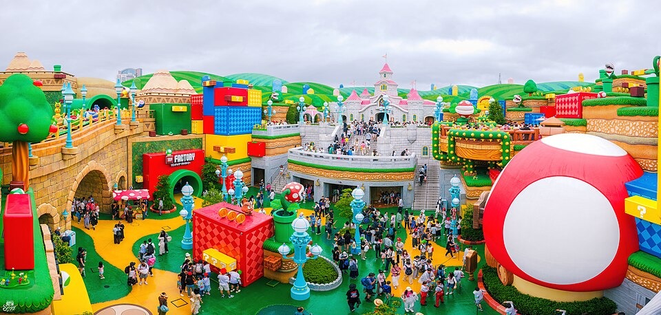 Visitors exploring the colorful Super Nintendo World area at Universal Studios Japan